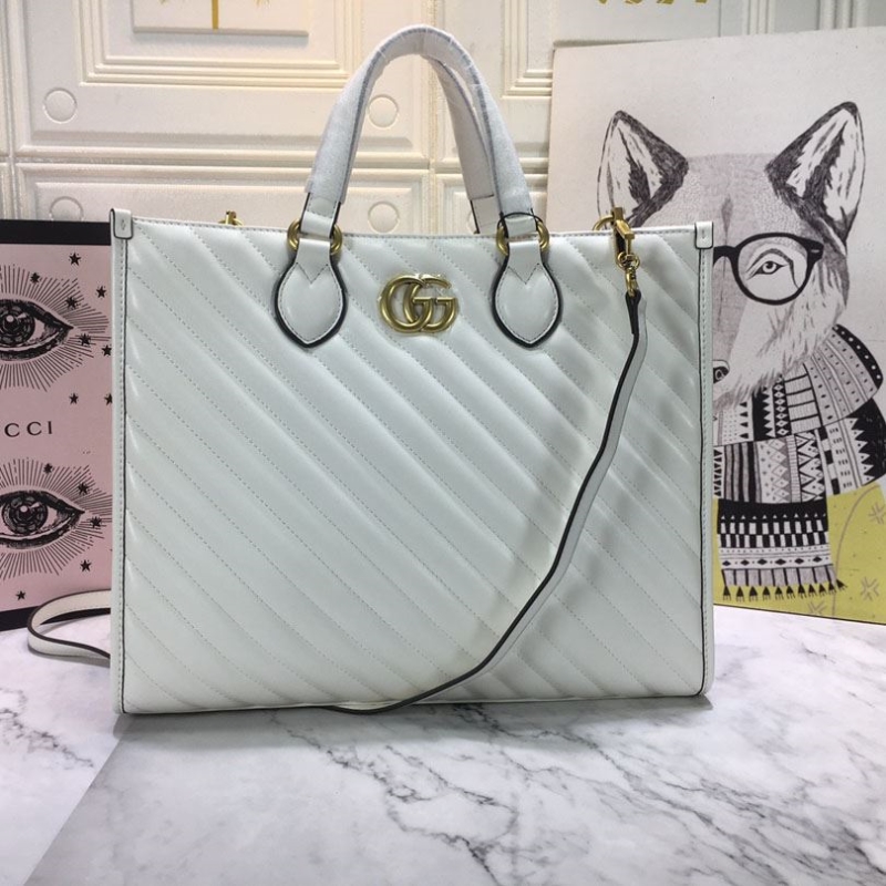 G*u*i shopping bags